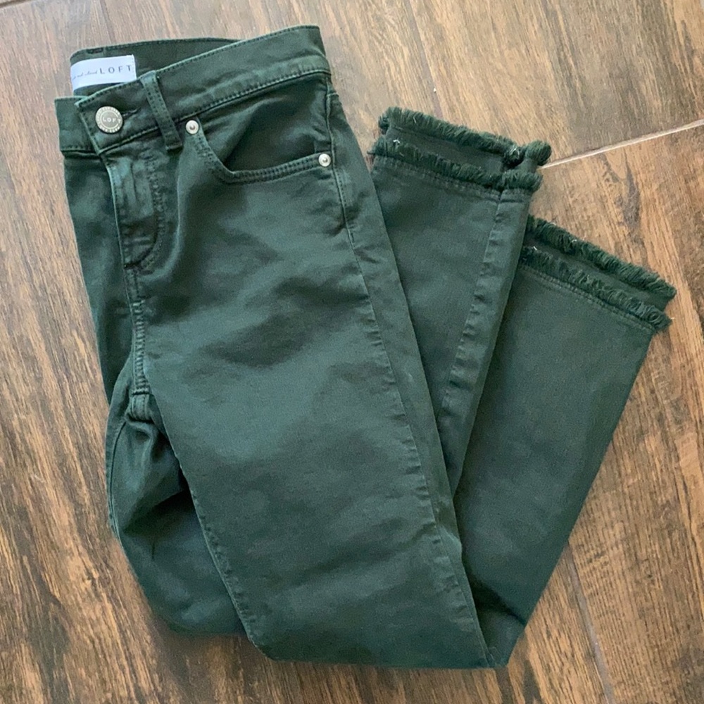 Like new! Dark green jeans with fringe bottoms!